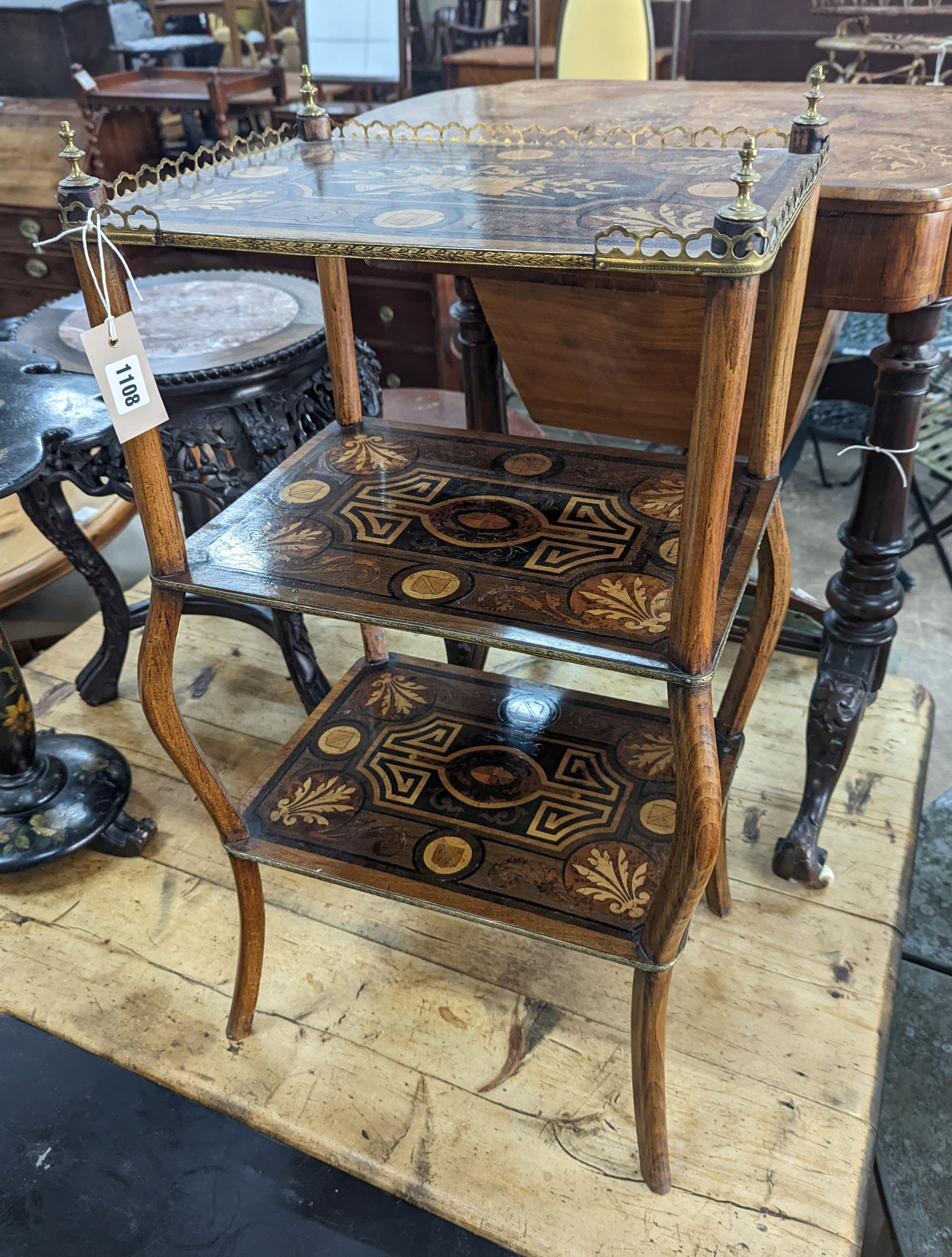 A 19th century French marquetry inlaid three tier etagere, width 42cm, depth 30cm, height 79cm